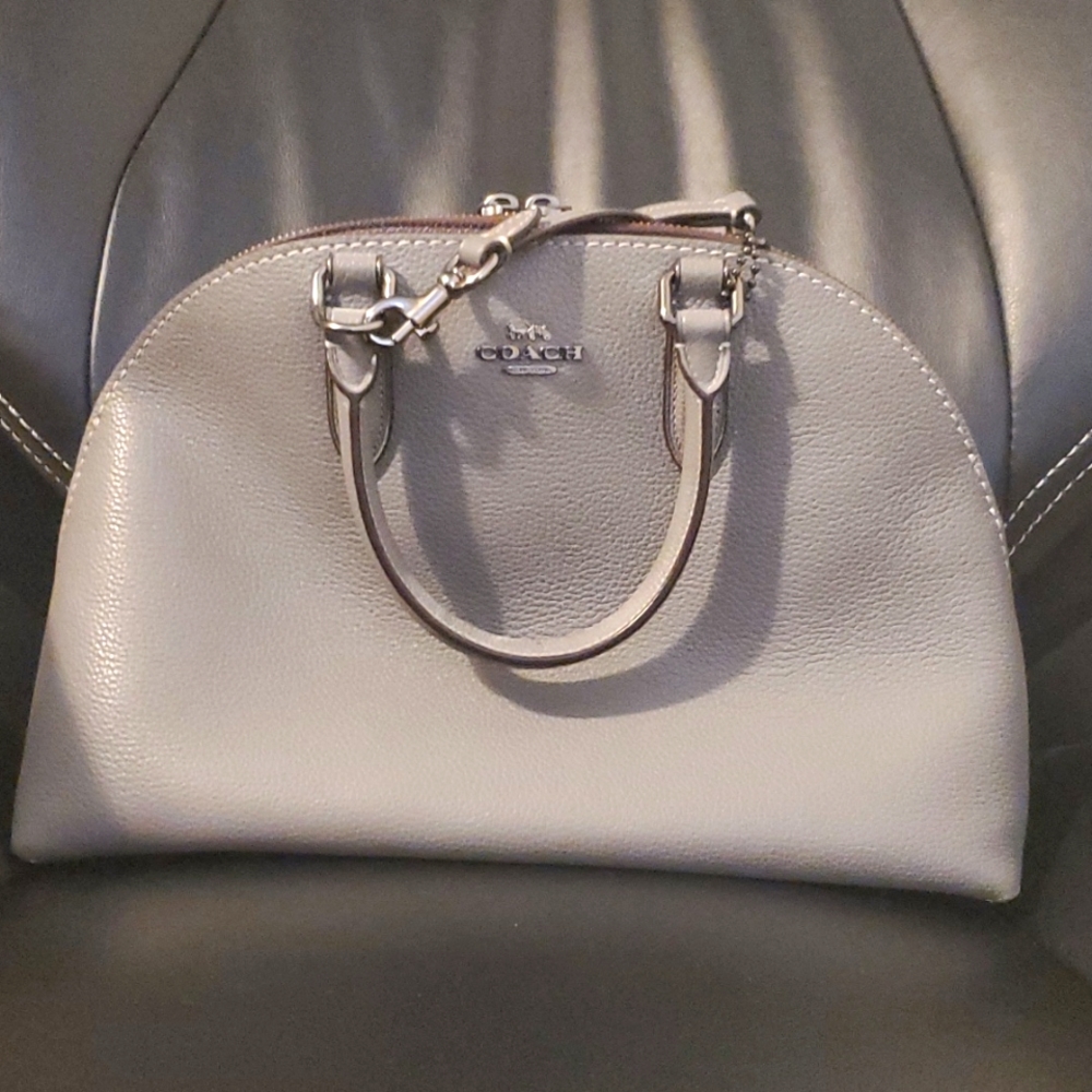 COACH's Quinn satchel polished pebble leather double handles and optional strap.